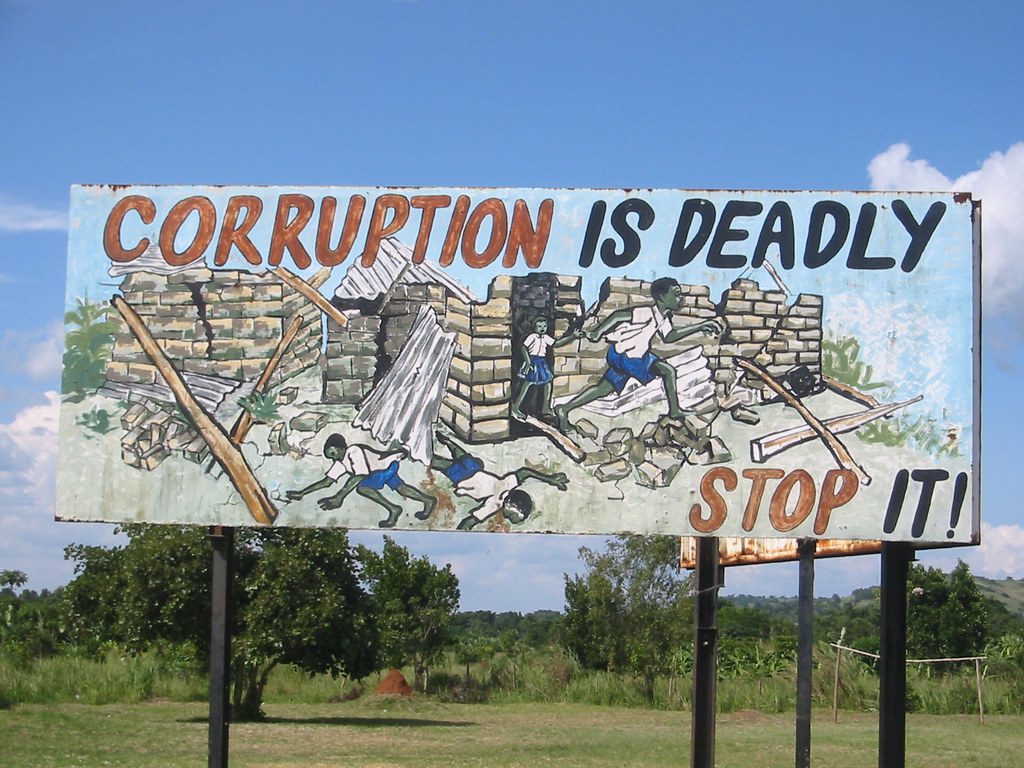 A sign saying corruption is deadly