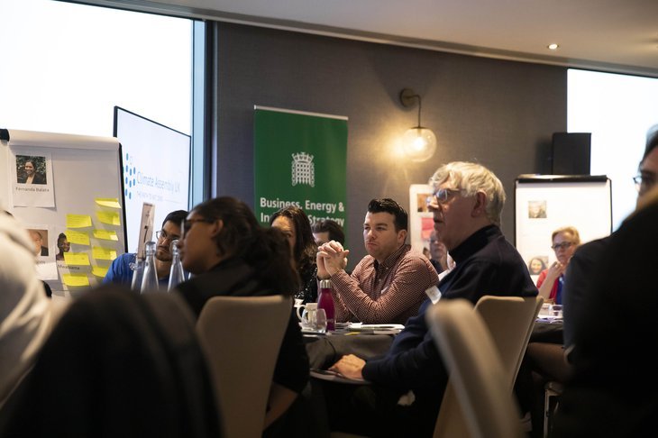 Participants in the Climate Assembly UK sitting at tables