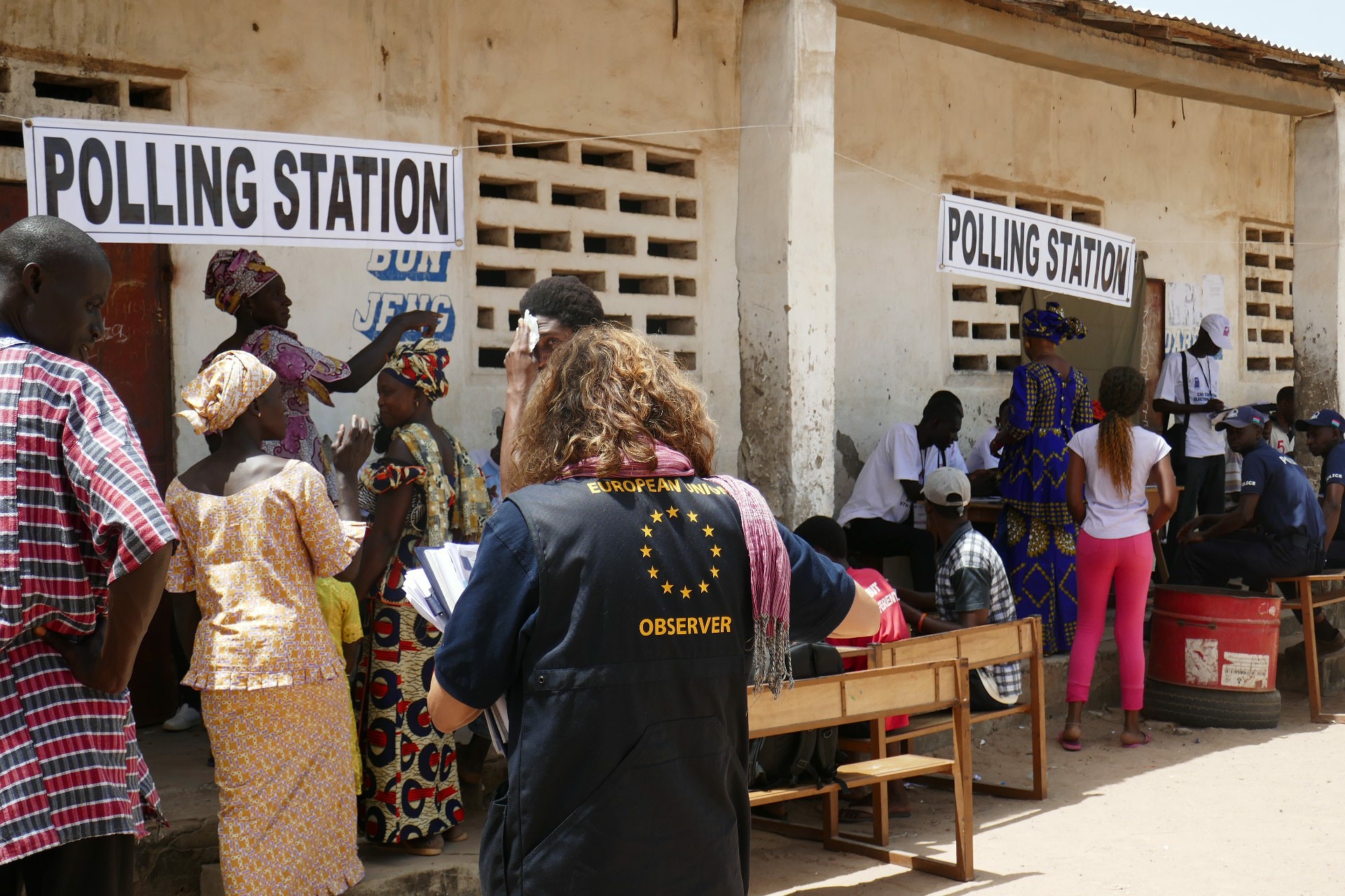 people queuing at a polling station