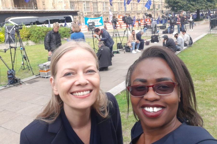 Two women smiling while taking a selfie