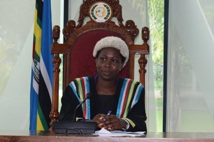 A woman sitting wearing parliamentary leadership robes