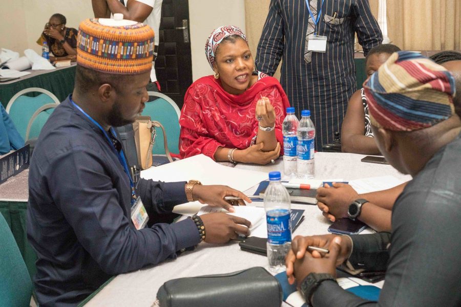 People discussing around a table in a meeting