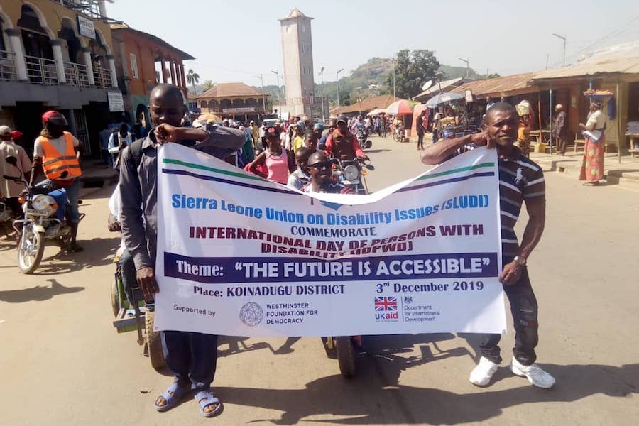 People holding a banner 