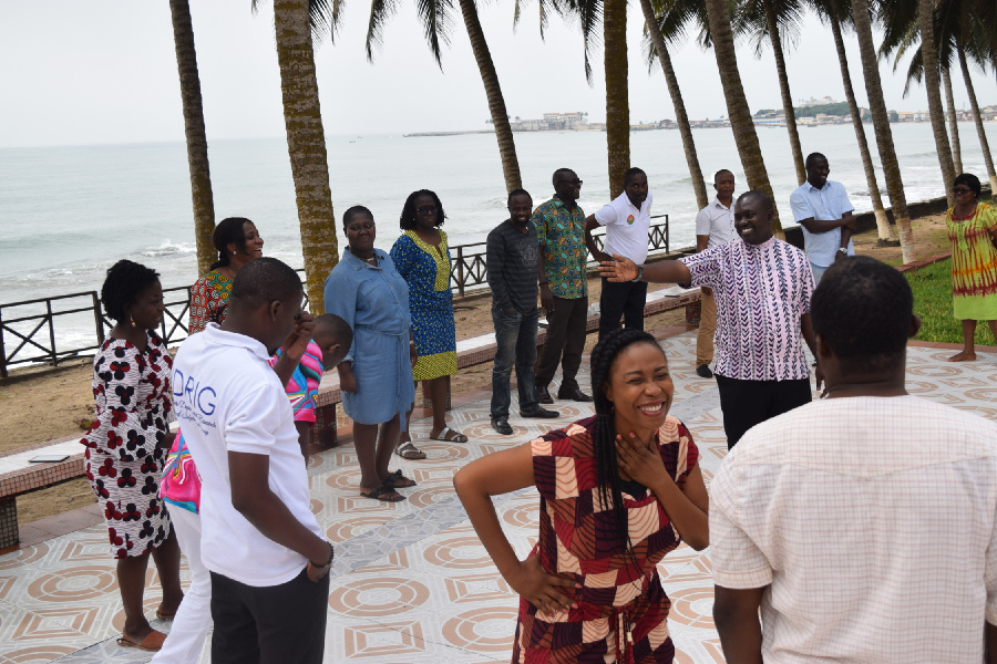 A group of people talking while standing