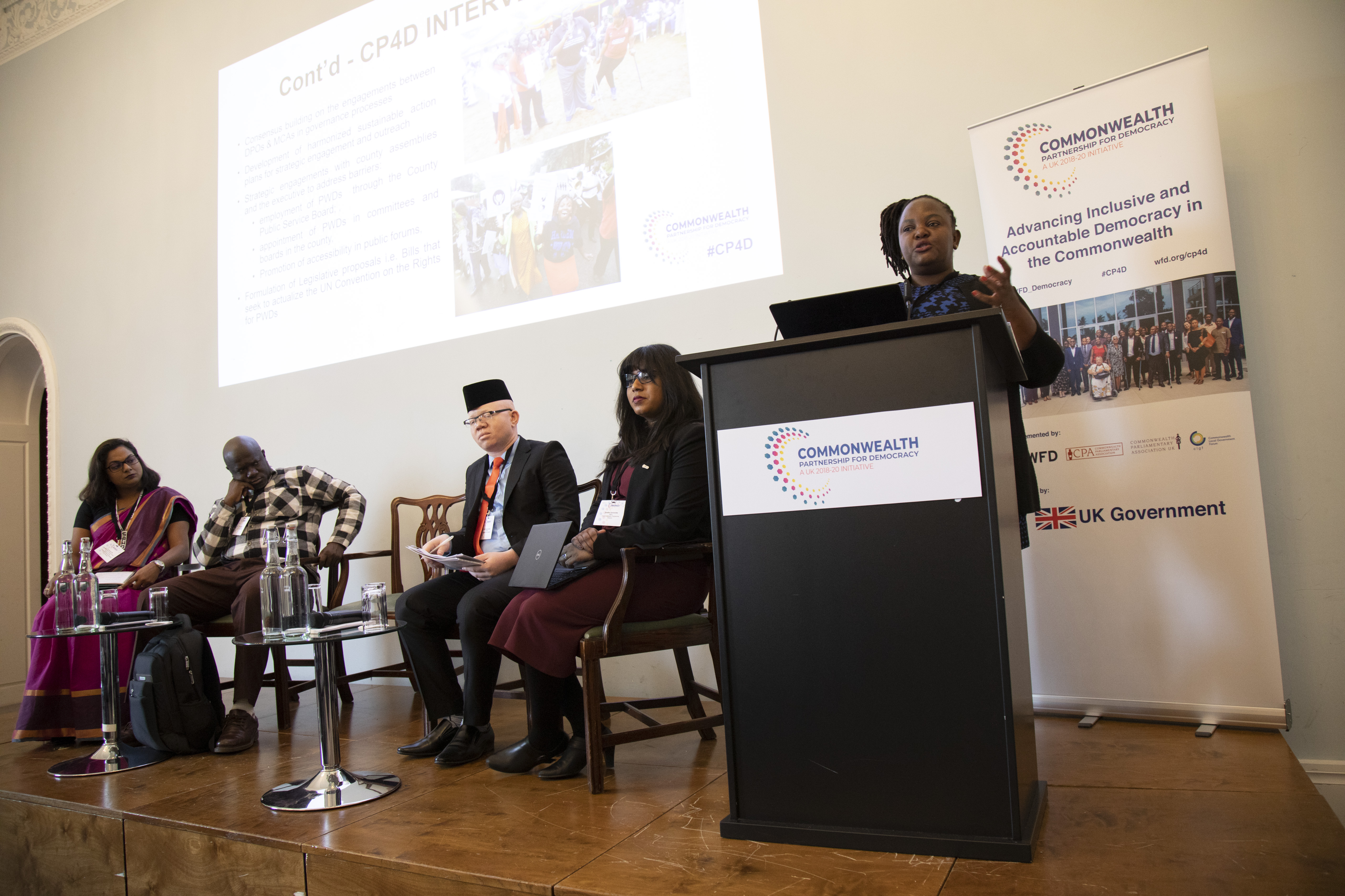 A person speaking at a podium at a CP4D conference