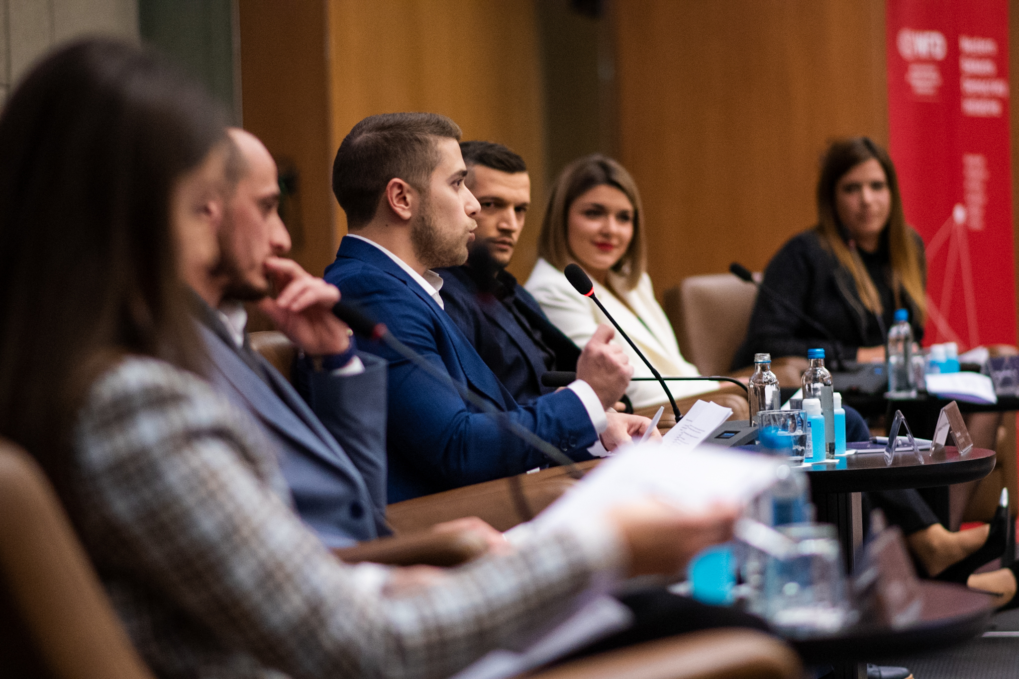 Young man speaking at a conference