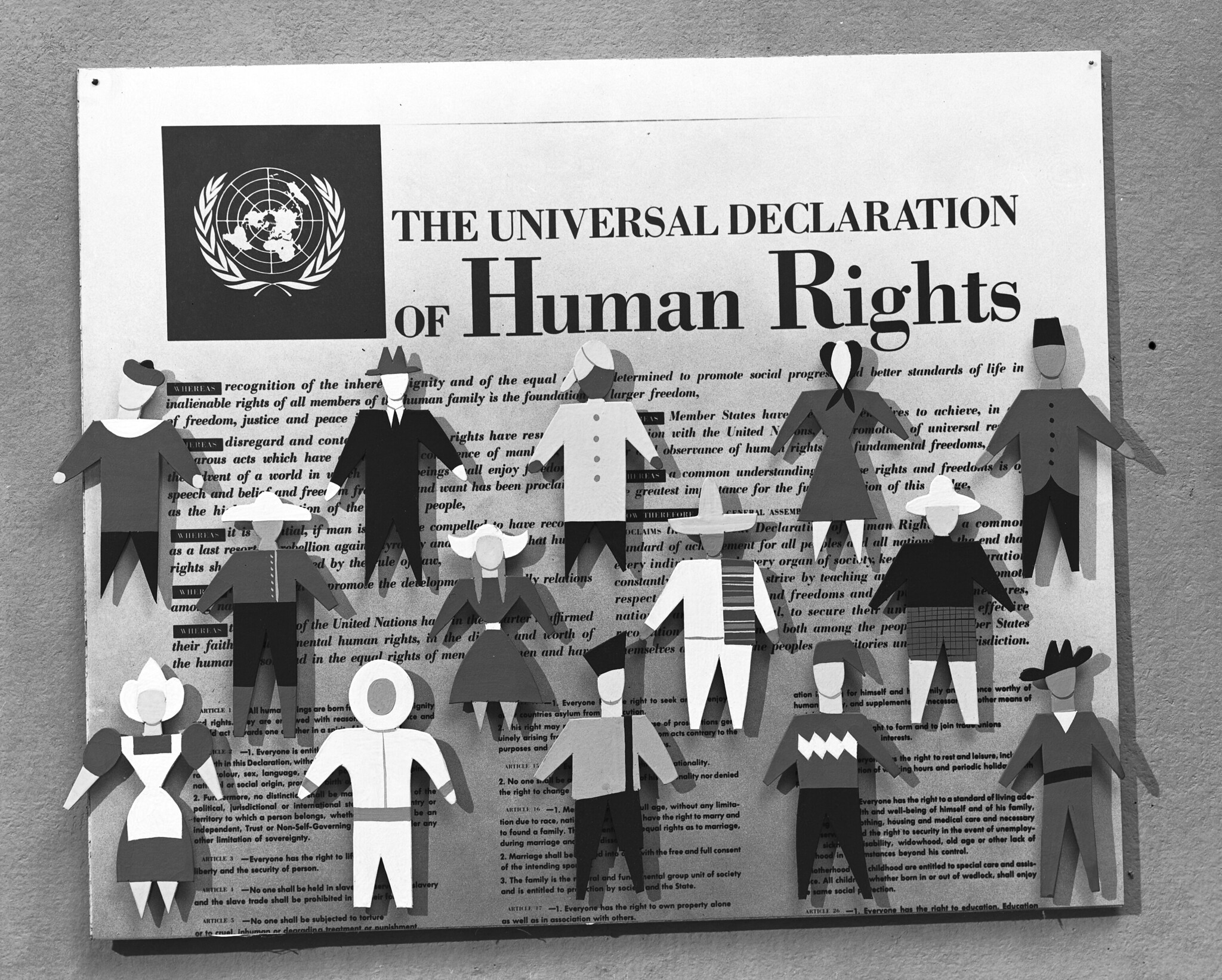 UN declaration of human rights with cut out figures of people