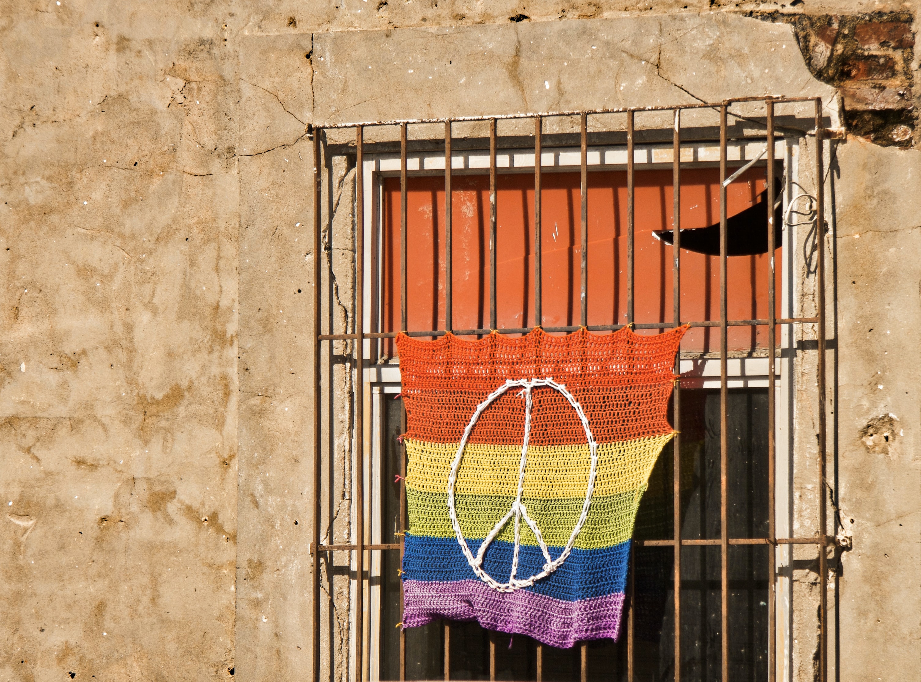 Rainbow flag on window bars