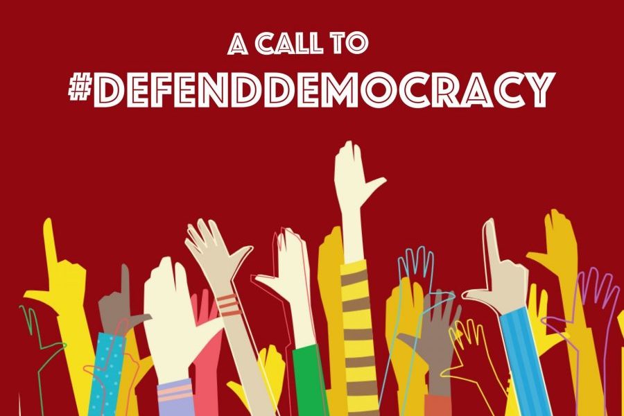 hands raised in the air under text saying a call to #defenddemocracy