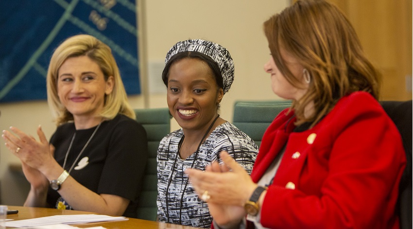 Three women smiling