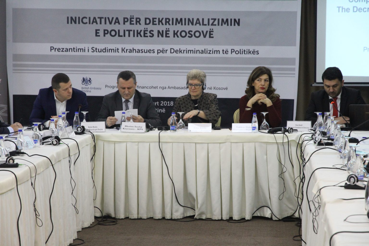 People sitting doing a press conference