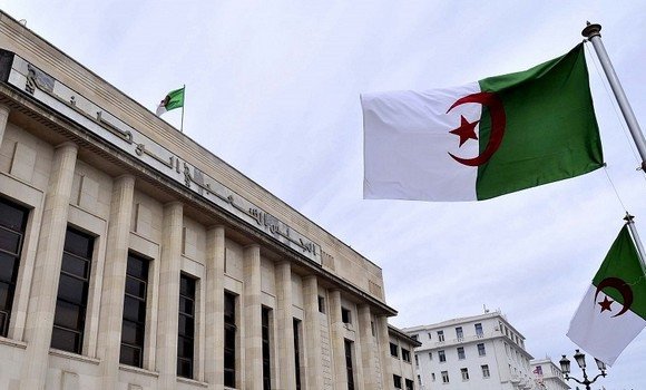 Algerian flags next to a building