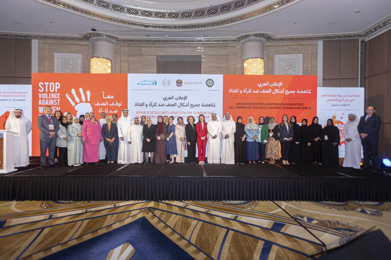 Group of people posing by standing on a line