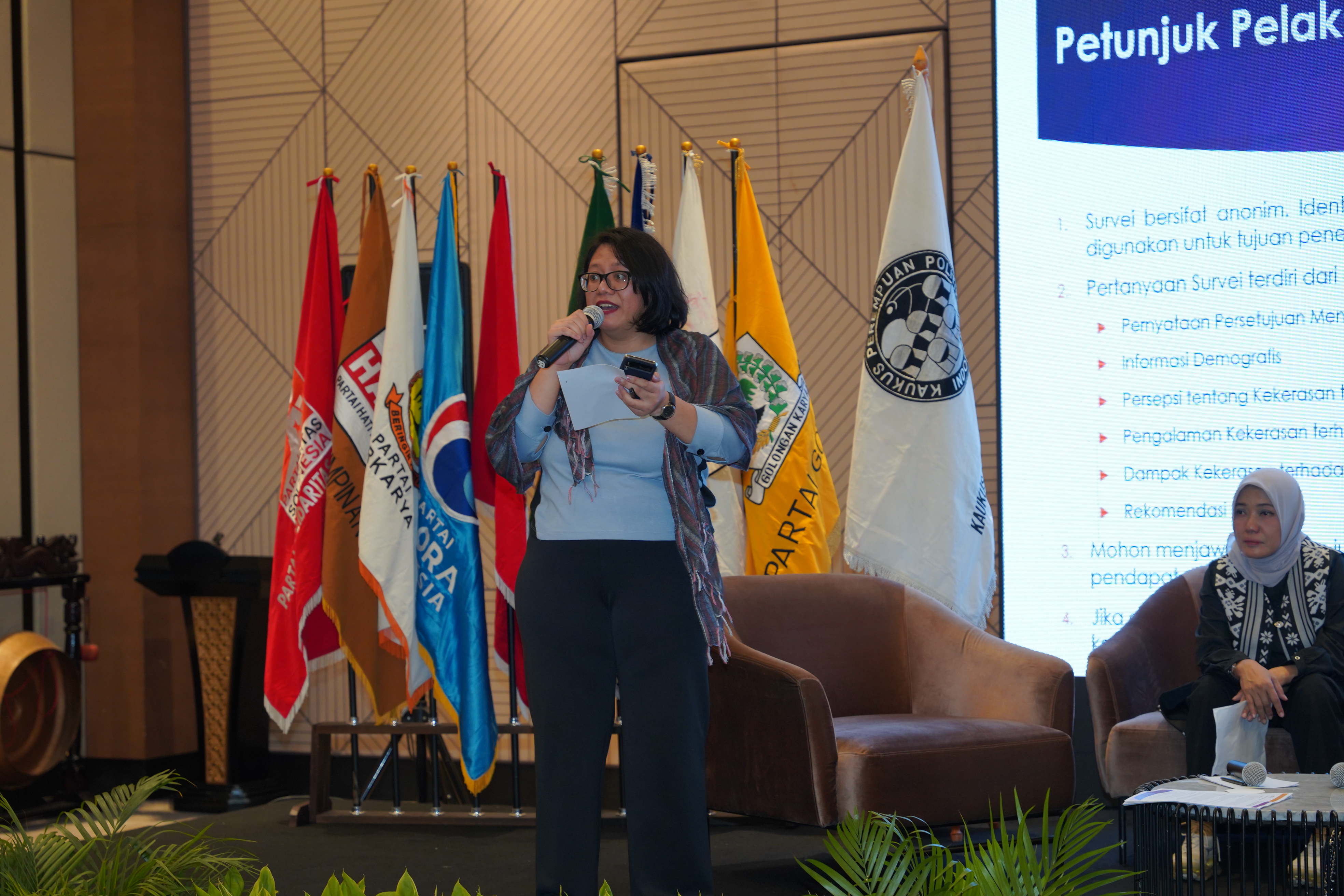 A speaker addressing the audience in a seminar
