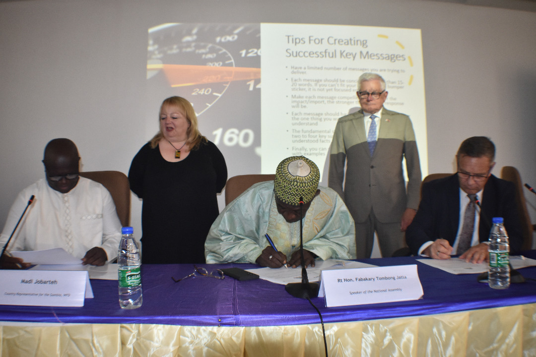 People signing a document