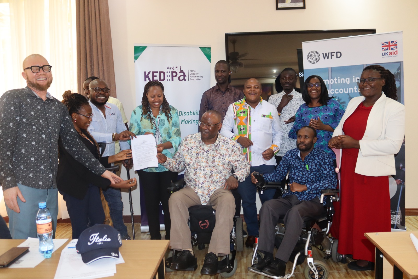 Partners handing over the memorandym of understanding to KEDIPA
