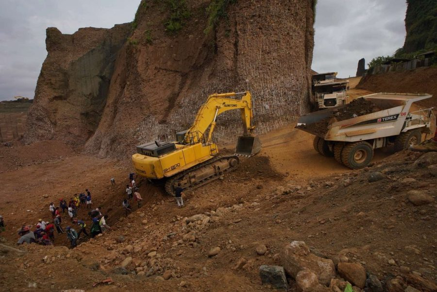 Digger excavating mine