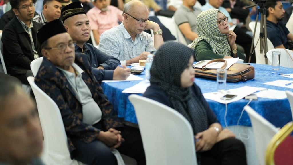 People sitting around a table in Bangsamoro, Philippines