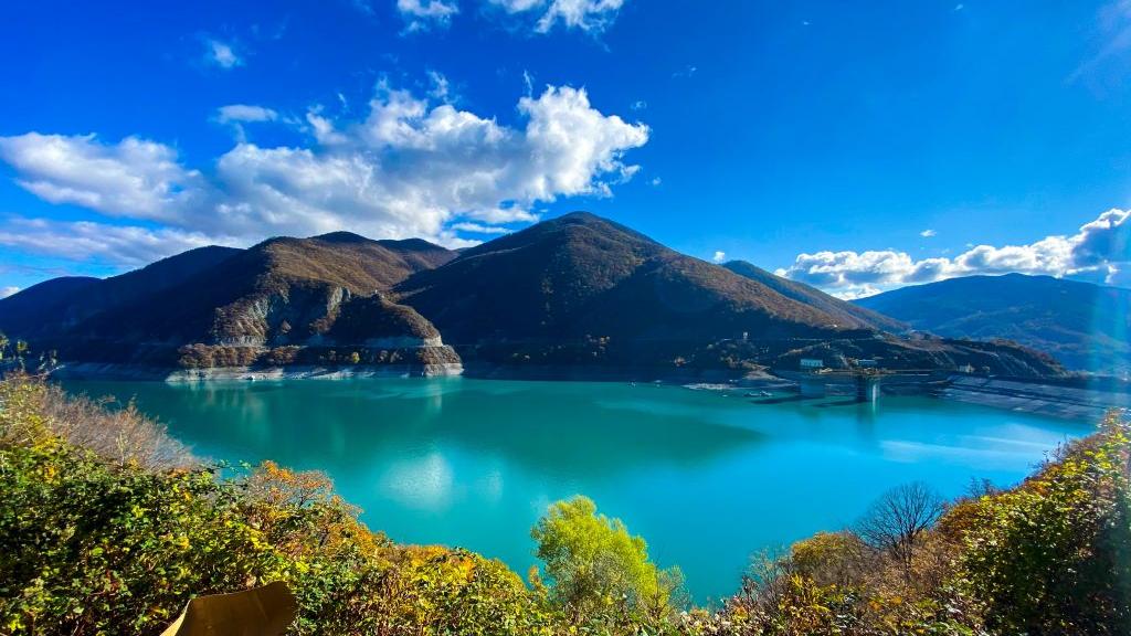 lake with mountains in the distance