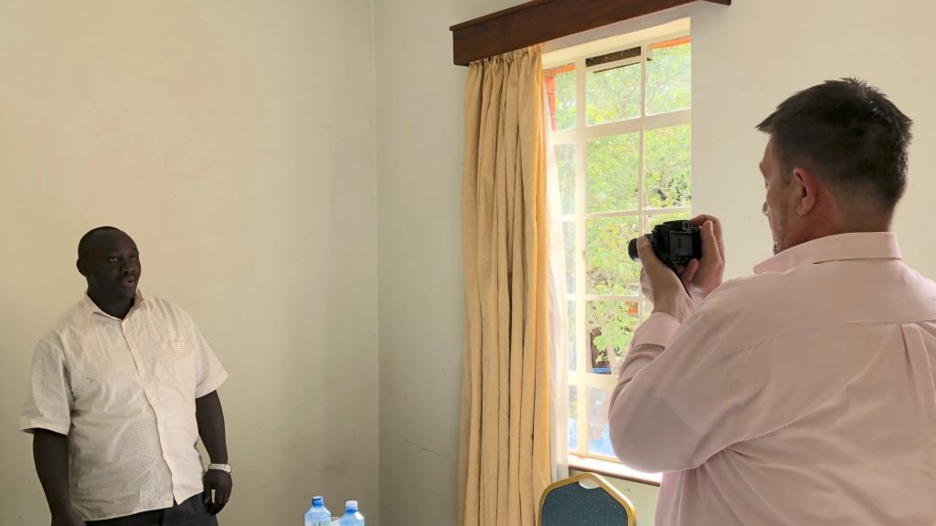 A person taking a picture of another