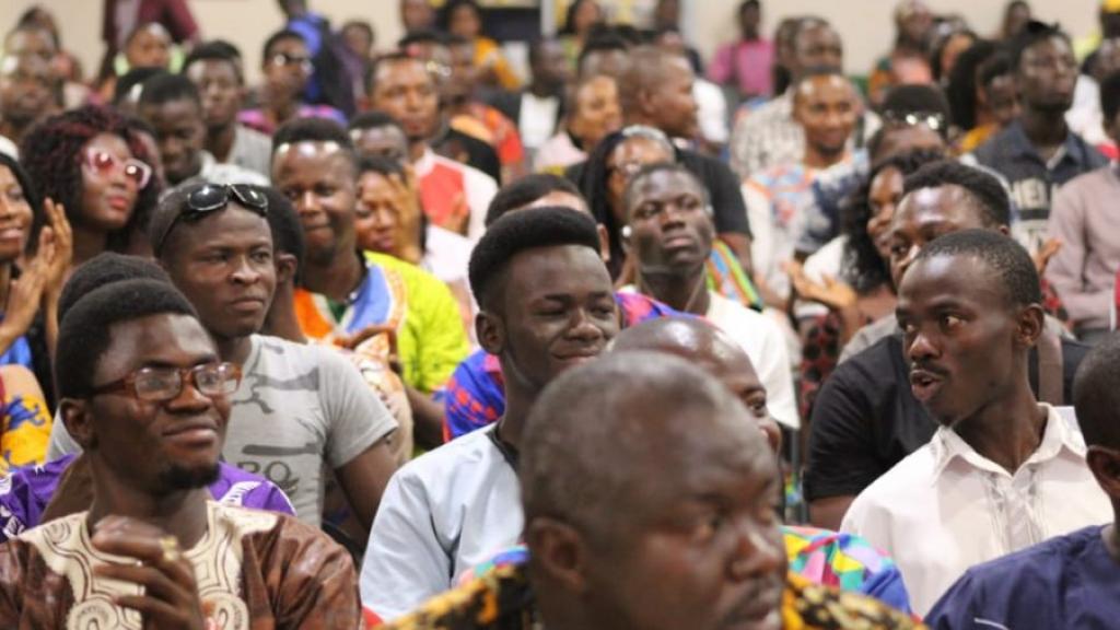 Many people in a townhall meeting