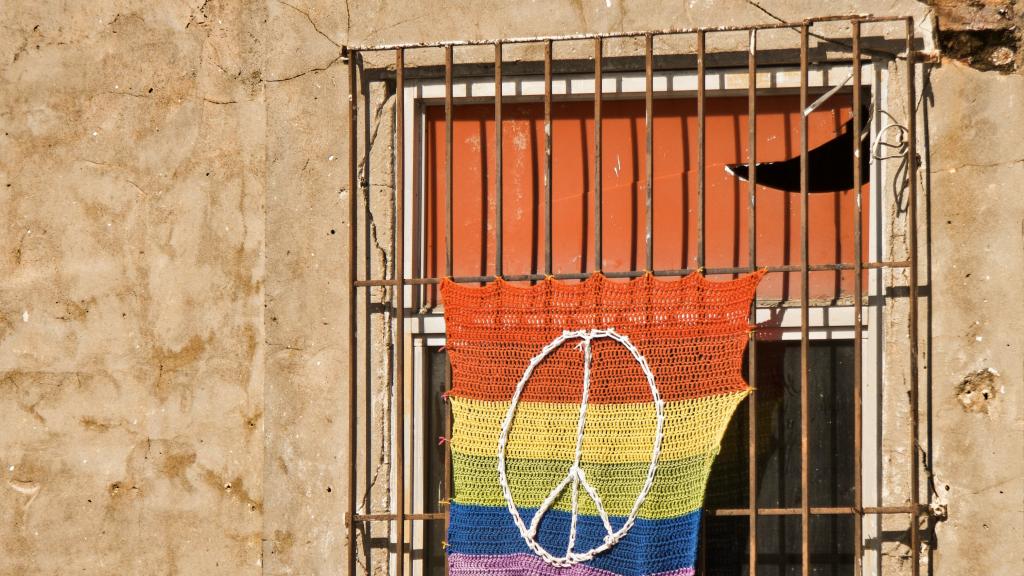 Rainbow flag on window bars