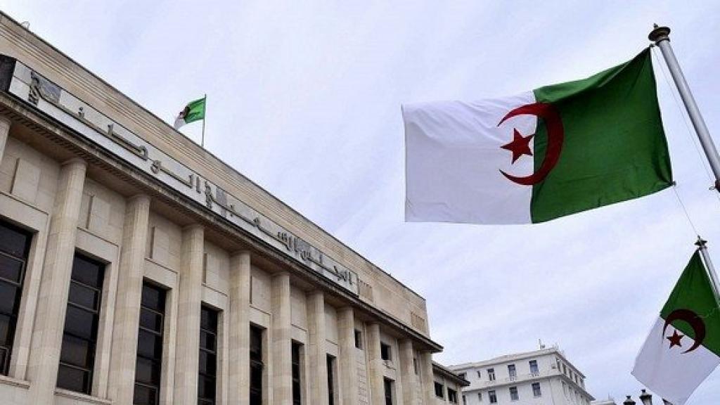 Algerian flags next to a building