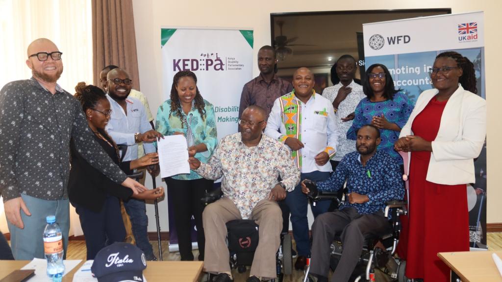 partners handing over memorandum of understanding  to KEDIPA