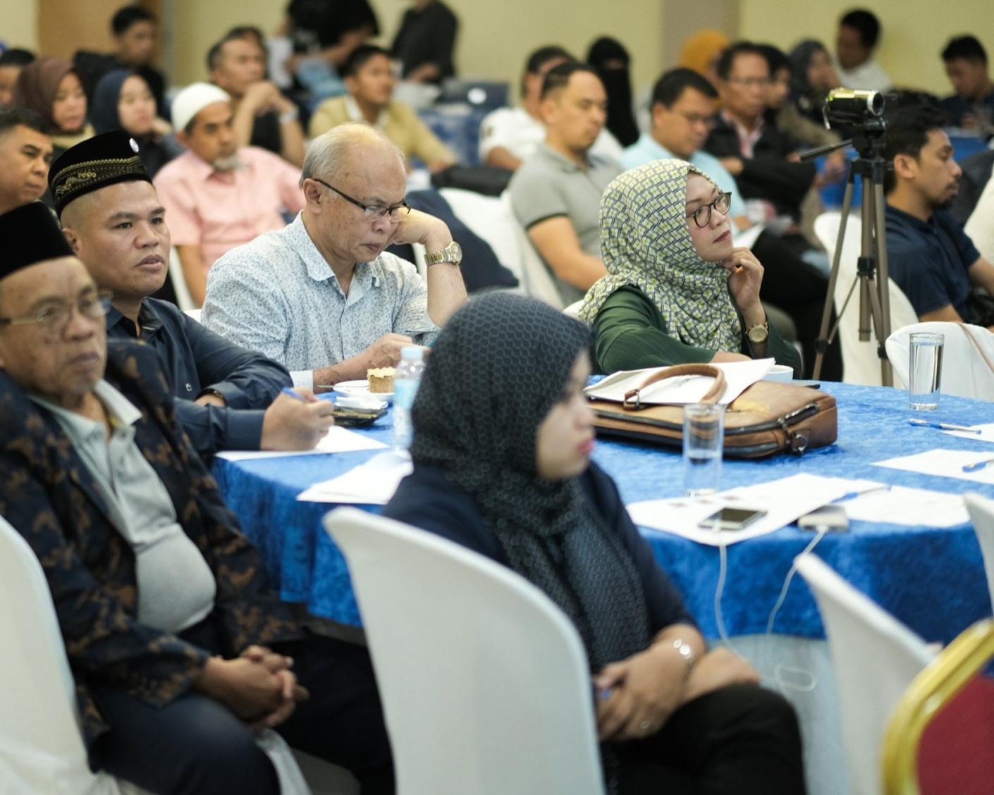 People sitting around a table in Bangsamoro, Philippines
