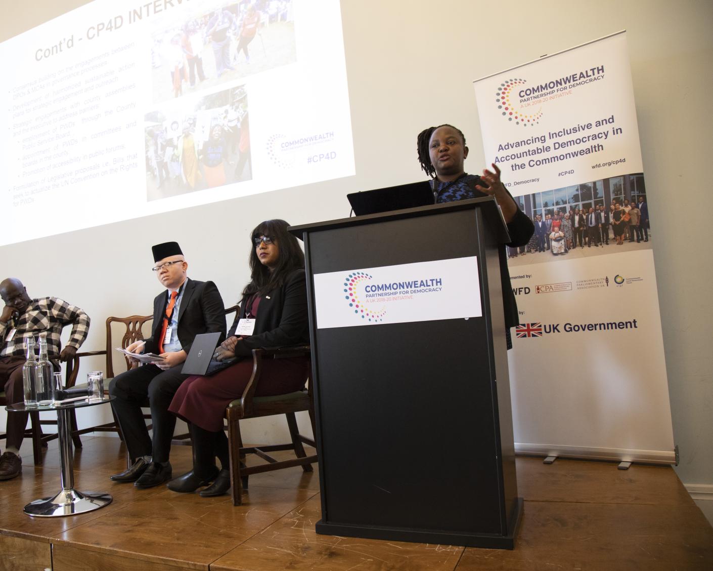 A person speaking at a podium at a CP4D conference