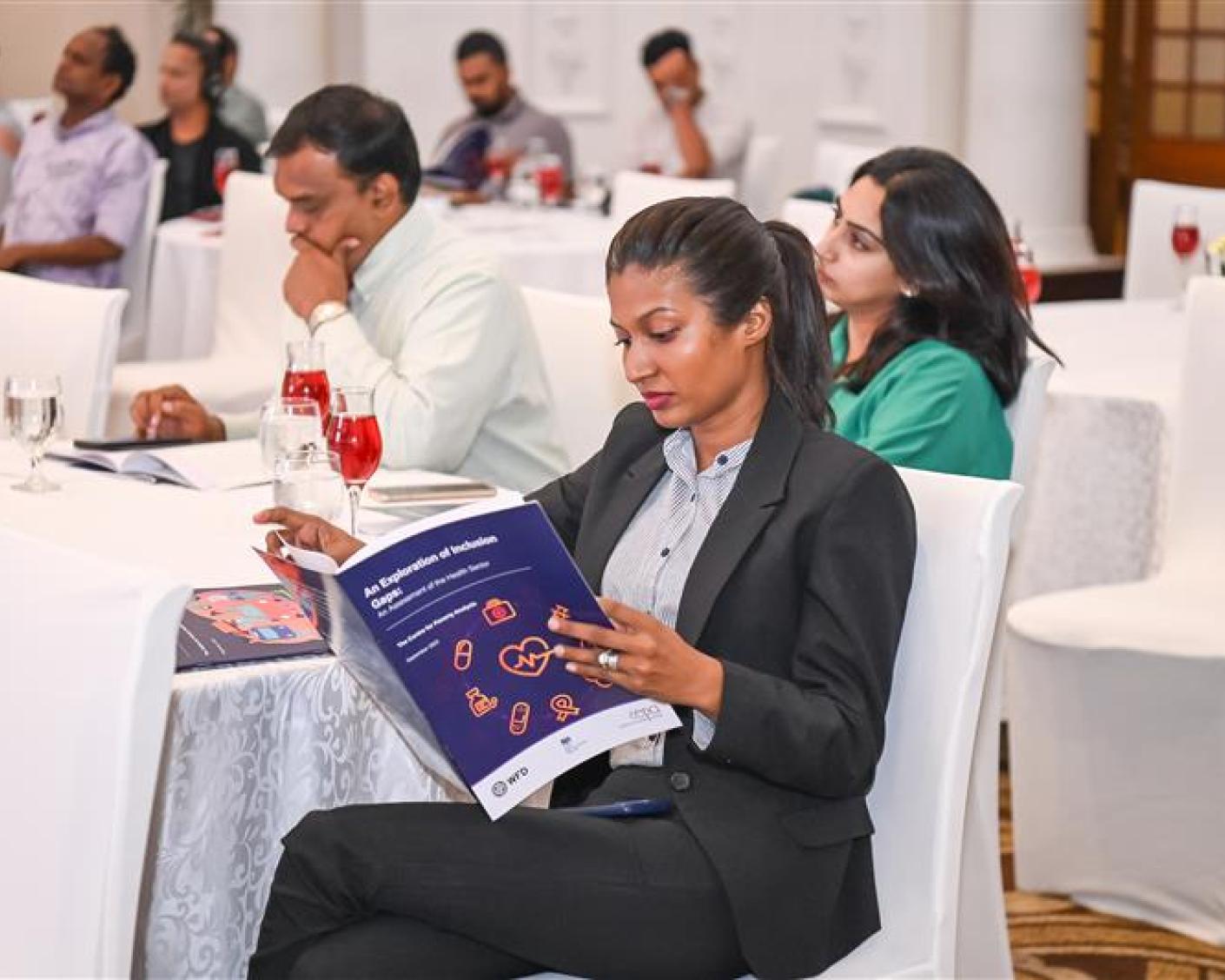 A participant reading WFD Sri Lanka's report