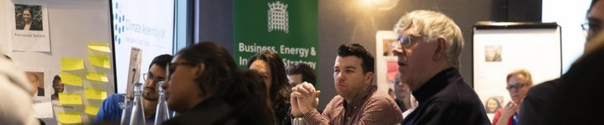 Participants in the Climate Assembly UK sitting at tables