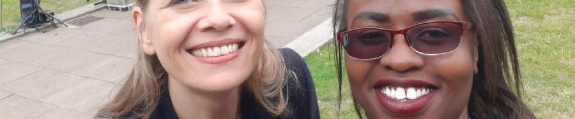Two women smiling while taking a selfie