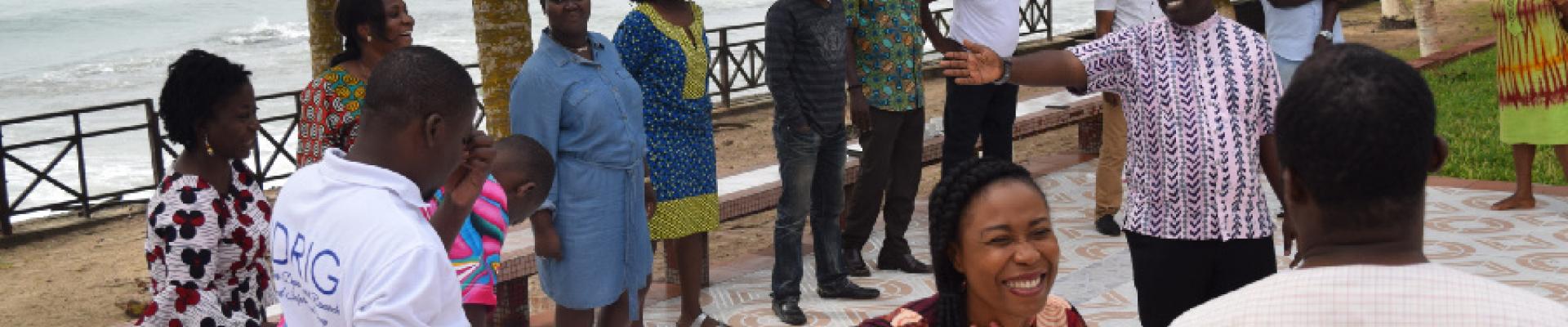 A group of people talking while standing