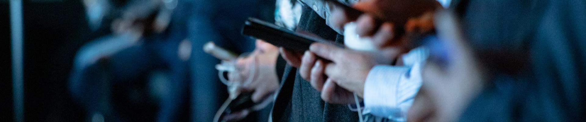 people on their smartphones