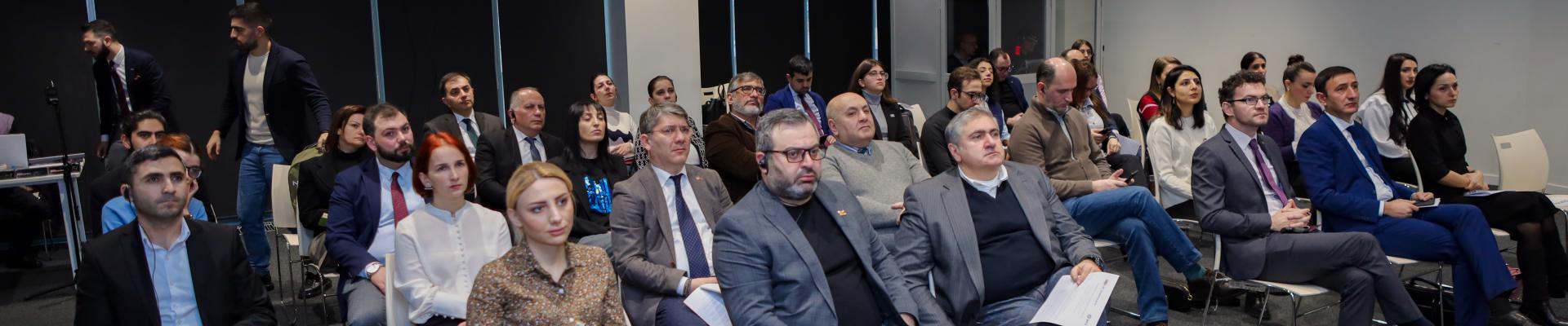Group of people participating in the launch event
