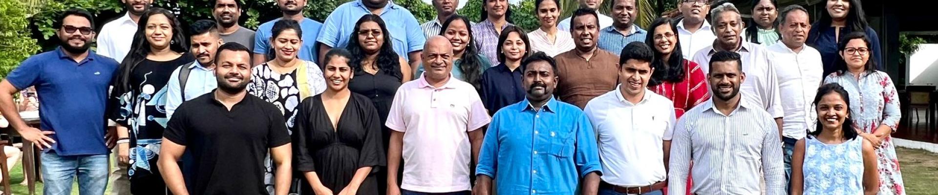 group of people smiling at the camera