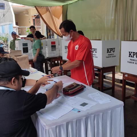 A picture of polling booth with election officials working during elections in Indonesia  