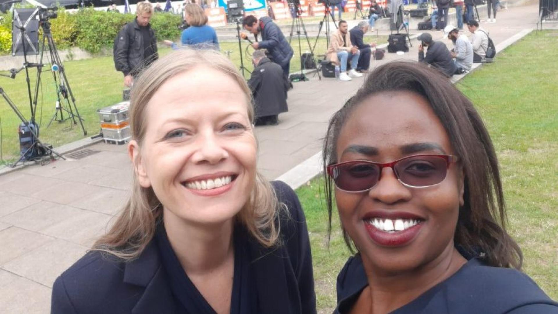 Two women smiling while taking a selfie