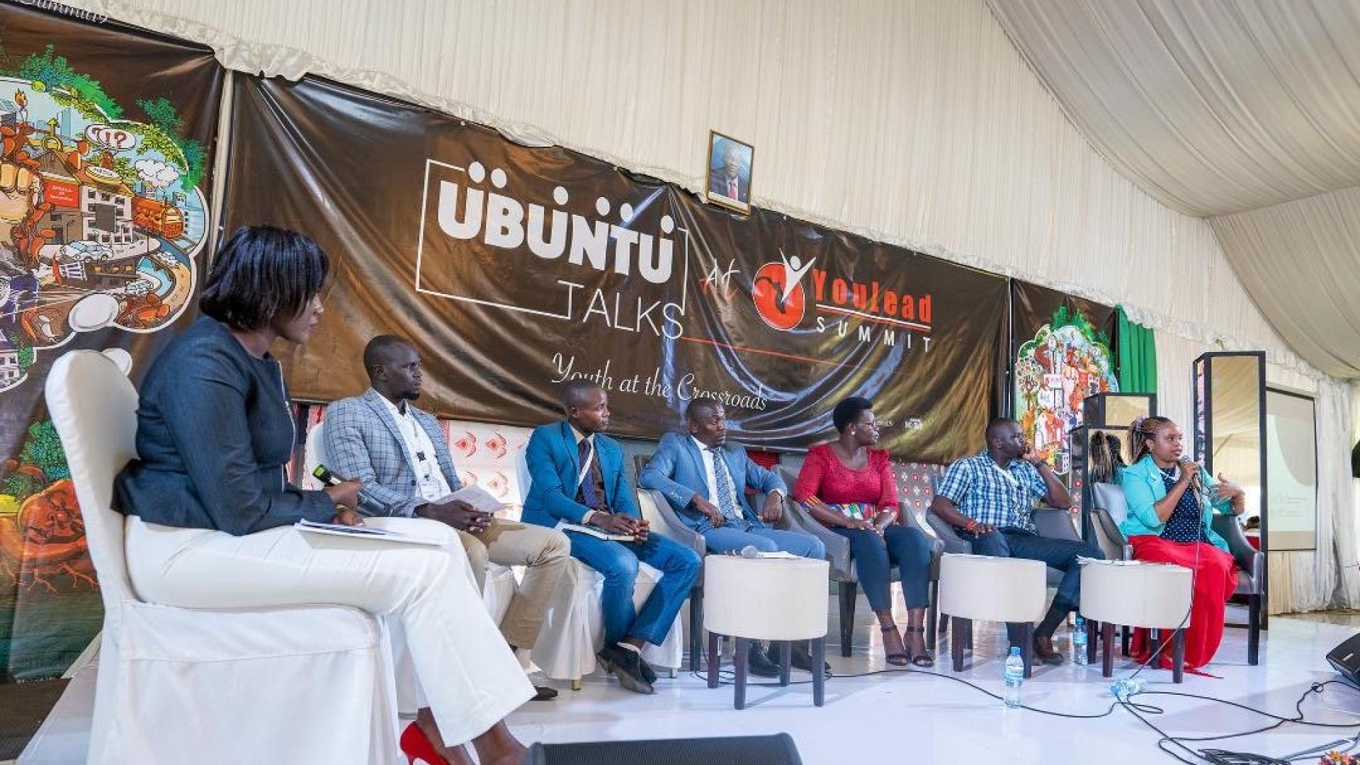 People sitting in a podium during an event