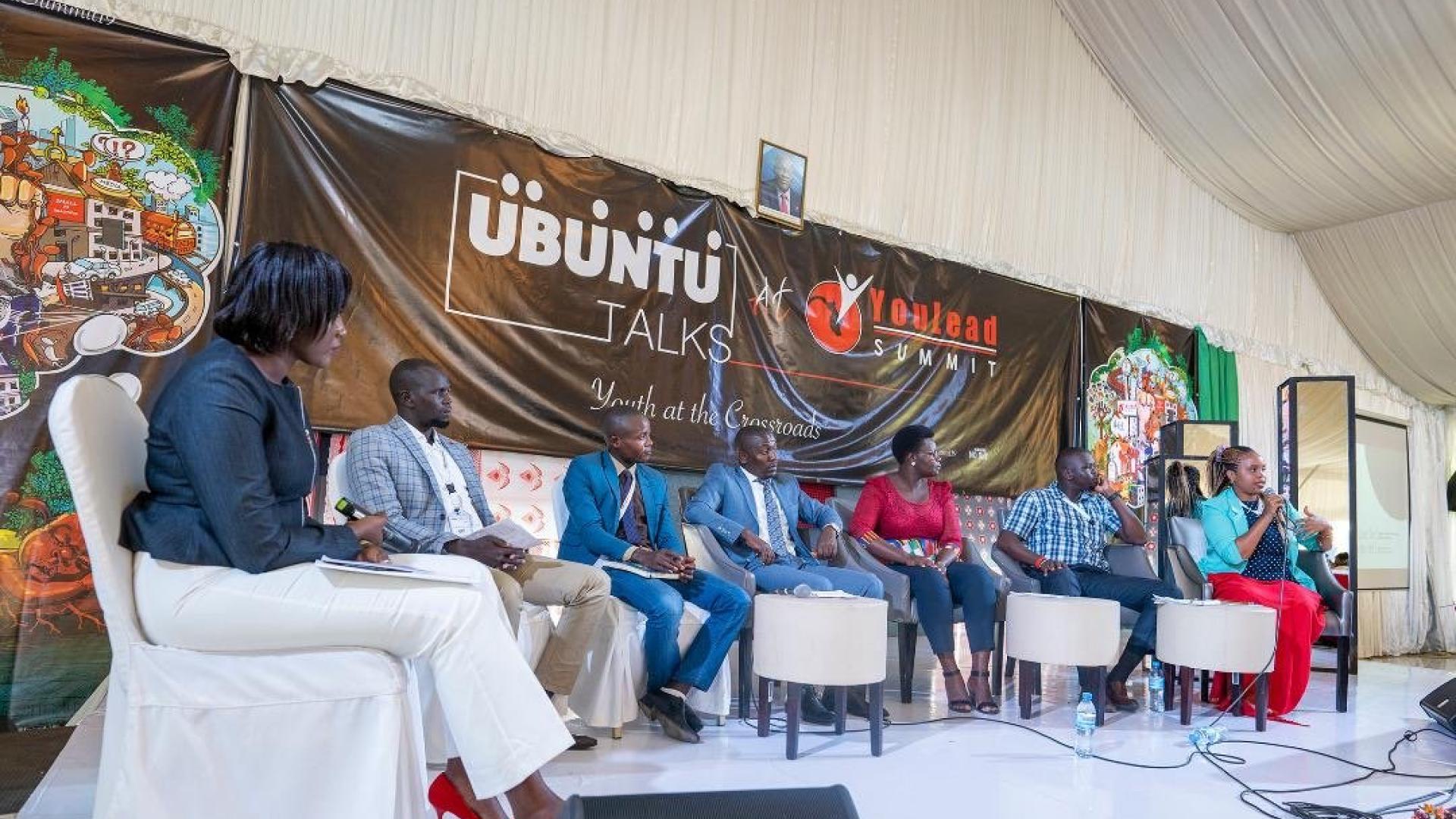 People sitting in a podium during an event