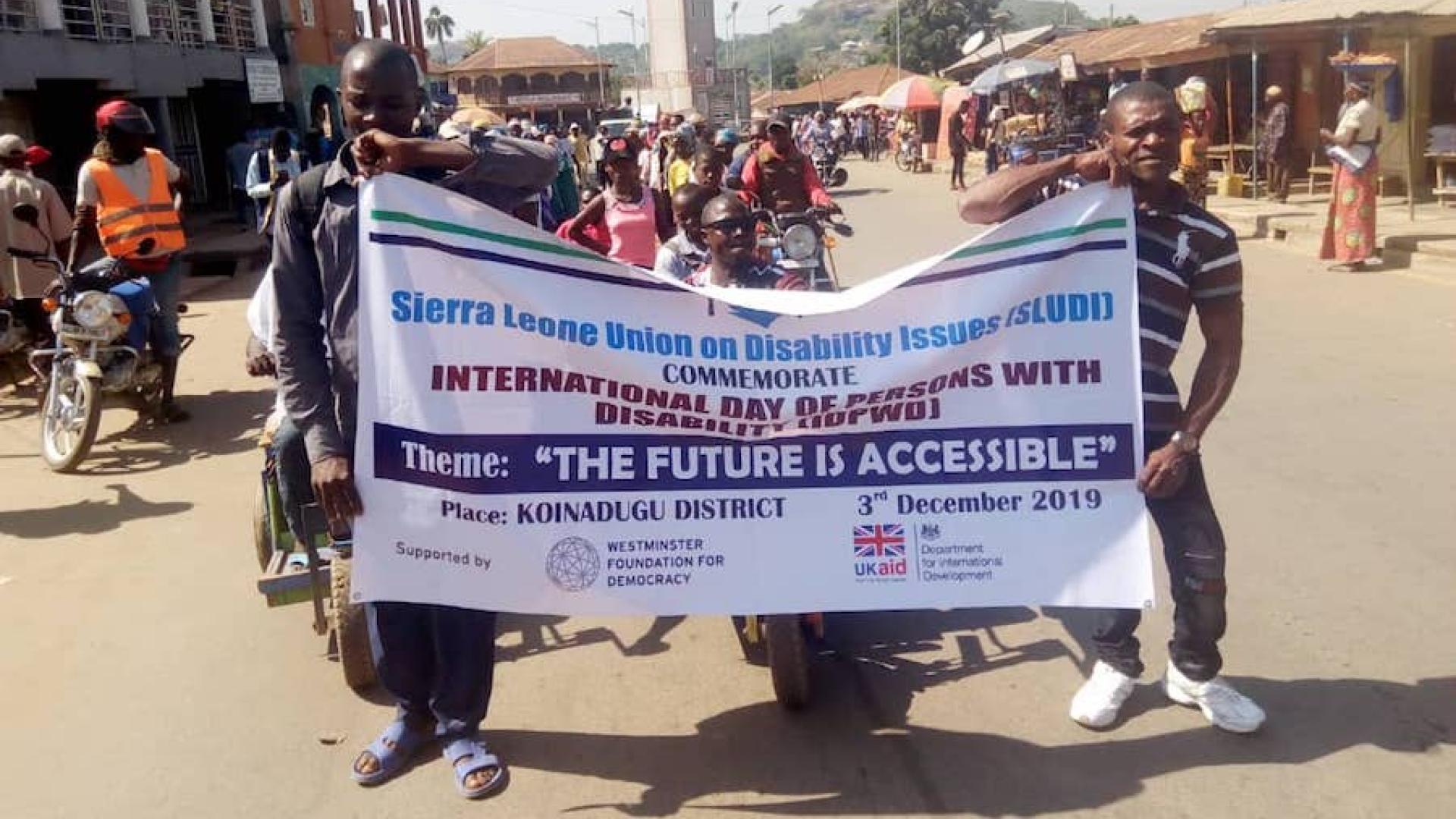 People holding a banner
