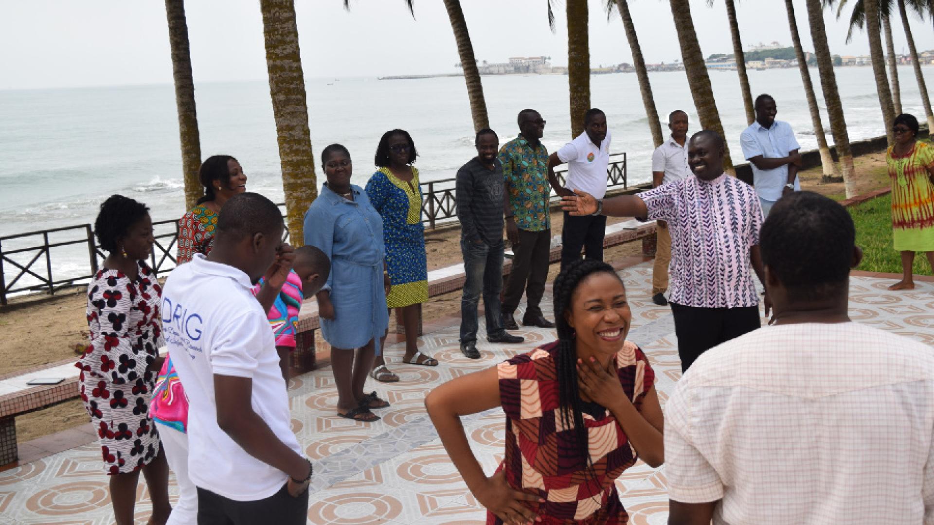 A group of people talking while standing