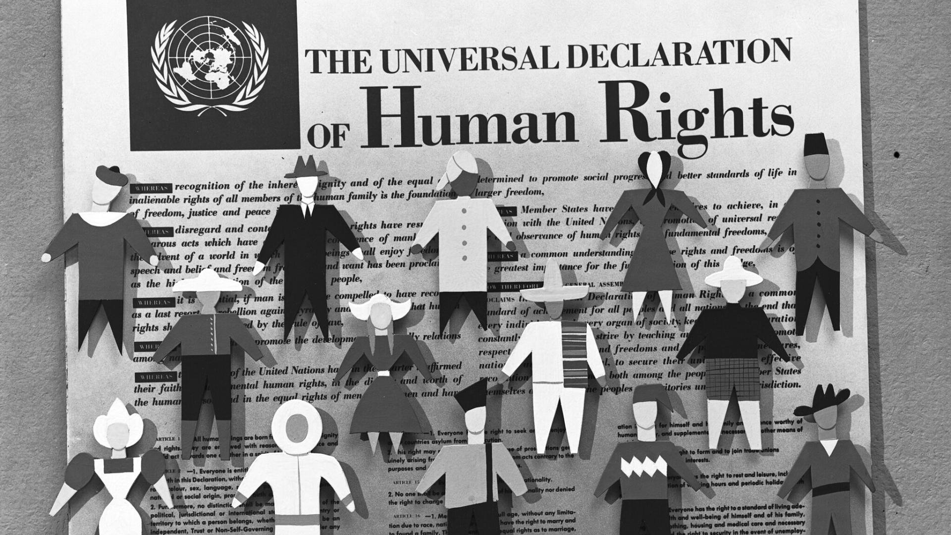 UN declaration of human rights with cut out figures of people