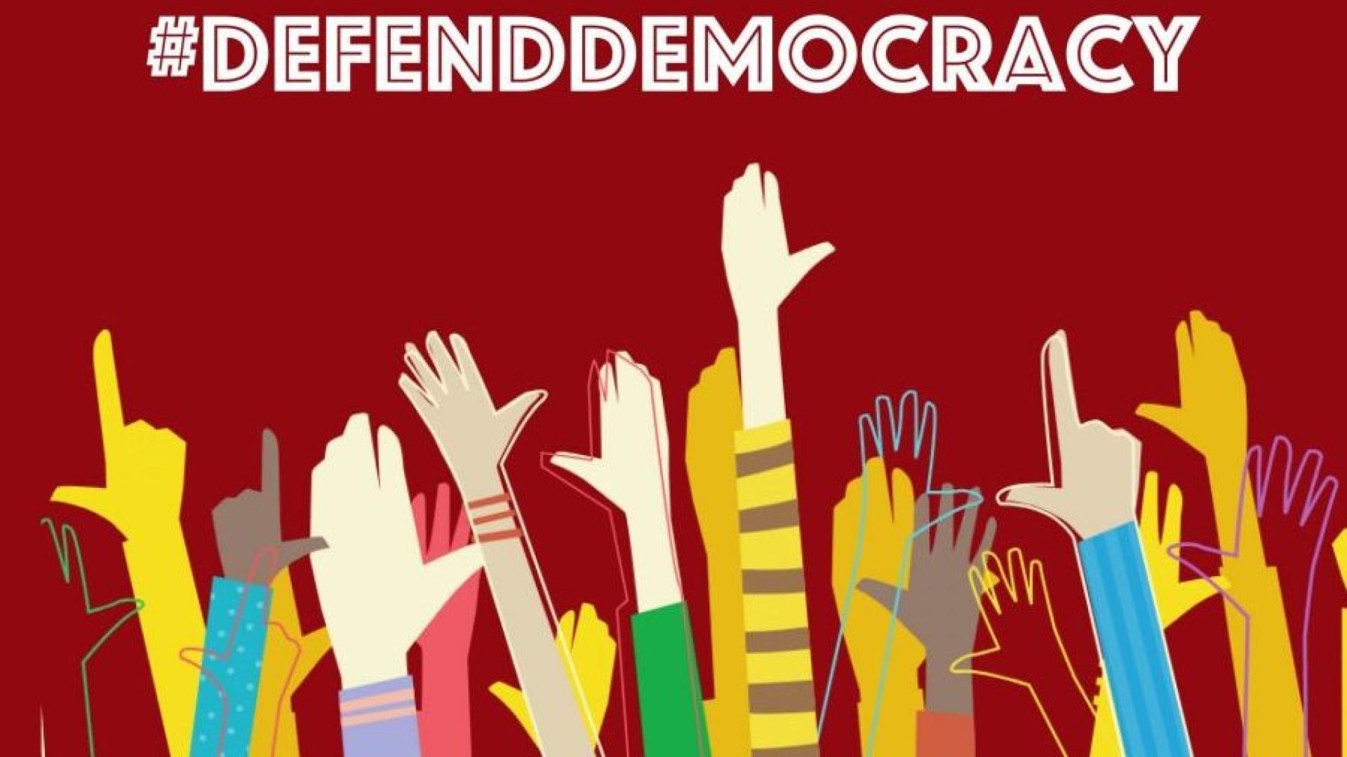hands raised in the air under text saying a call to #defenddemocracy