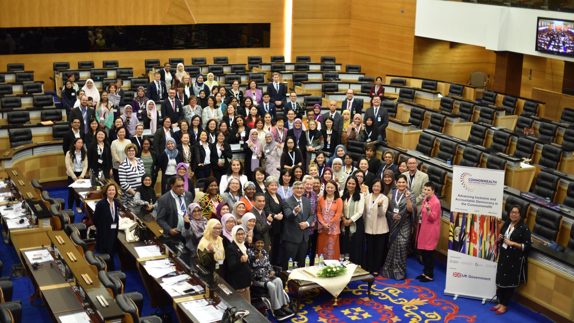 A large group of people in a conference hall