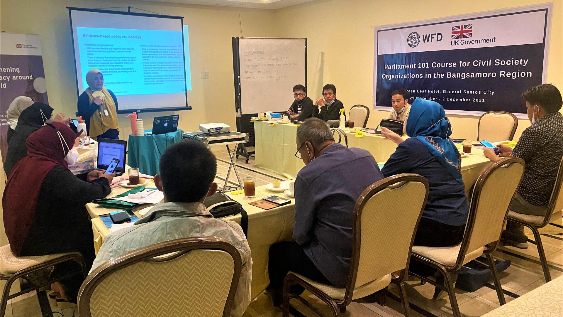 participants sitting around a table at a training session