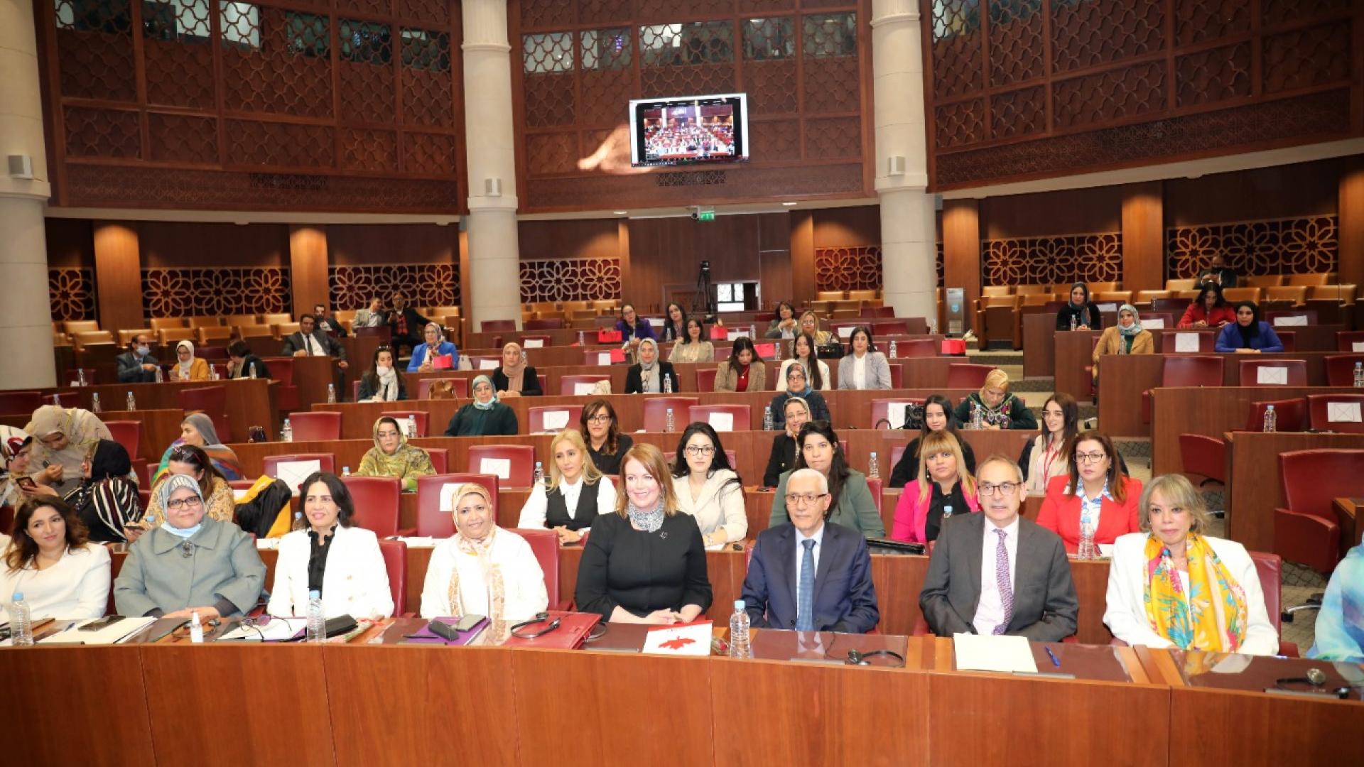 Group of people posing by sitting