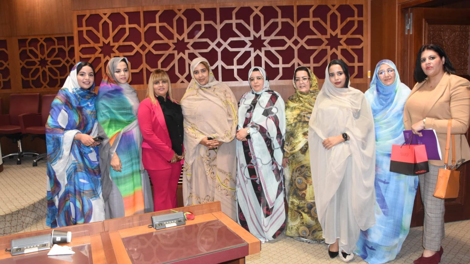 Women posing for a picture by standing