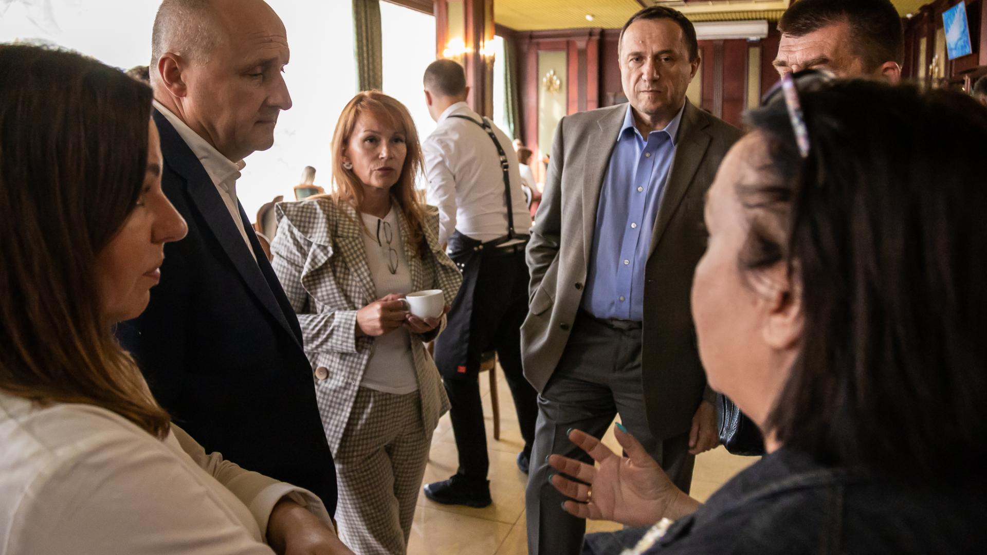 Photograph of people talking at Verkhova Radna event